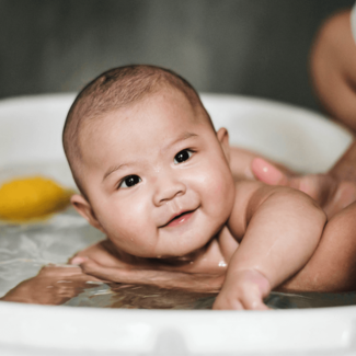 Mother Bathing Baby